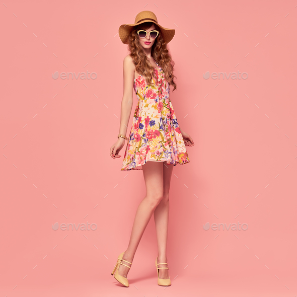 Fashion Young woman.Floral Dress, Heels, Hairstyle - Stock Photo - Images