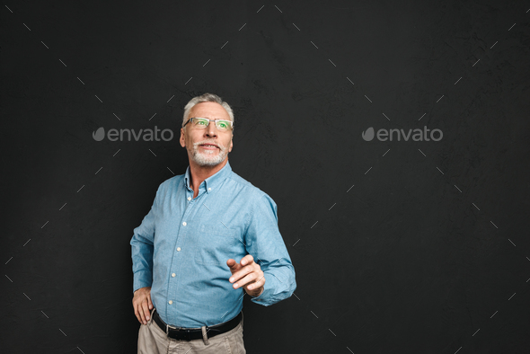 Portrait of elderly man 70s with grey hair and beard wearing for - Stock Photo - Images