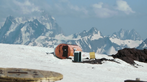 Orange Metal Barrel Tourist Shelter at Hight Mountain Picturesque Landscape