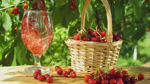 Cherry Juice Poured in To Wine Glass. alt