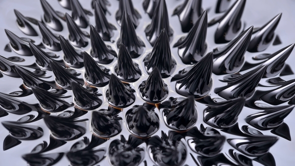 Ferromagnetic Fluid Creates Amazing Drawings in a Magnetic Field, Stock ...