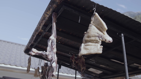 Jerky Meat Hanging Under Metal Tile Roof at Mountain Village