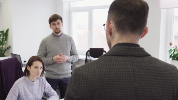 Business Man Talking with His Colleagues in Office