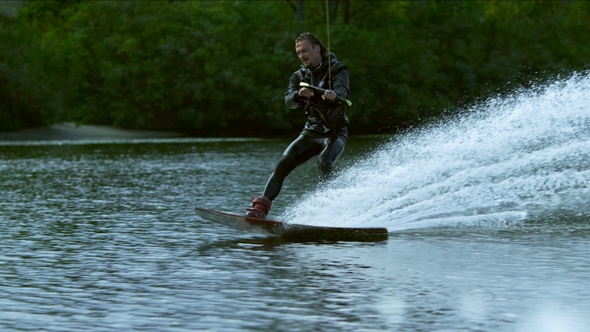 Wake Boarding on River. Male Rider Enjoy Wakeboarding, Stock Footage