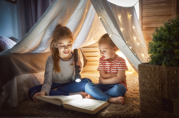 child is reading a book - Stock Photo - Images