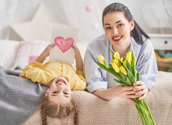 daughter is congratulating mom - Stock Photo - Images