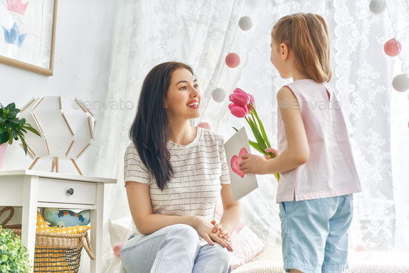daughter is congratulating mom - Stock Photo - Images