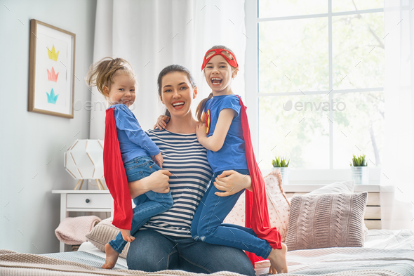 Mother and her children playing together - Stock Photo - Images