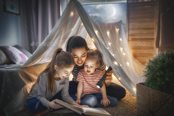 Mom and children reading book - Stock Photo - Images