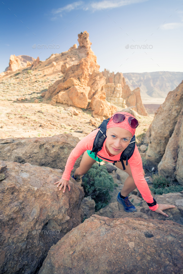 Woman hiker reached mountain top, summer activity