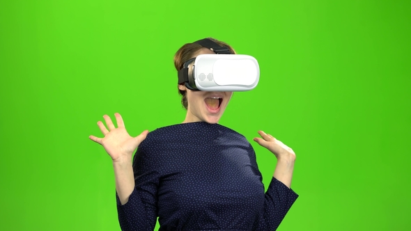 Woman in Virtual Glasses Is Watching an Interesting Film alt