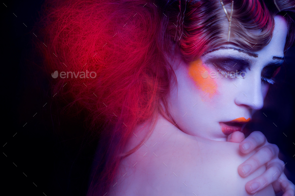 High Fashion model woman in colorful bright lights posing in studio - Stock Photo - Images