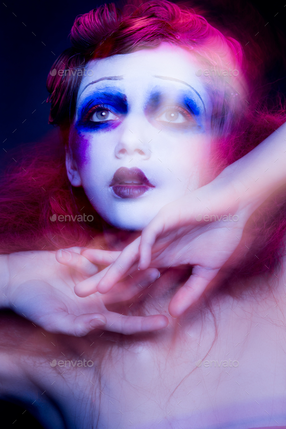 High Fashion model woman in colorful bright lights posing in studio - Stock Photo - Images