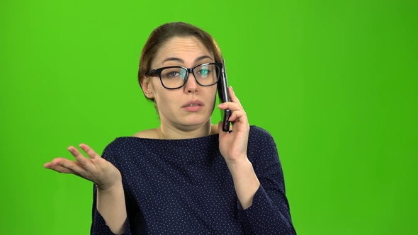 Businesswoman Speaks on the Phone and Is Angry with the Interlocutor alt