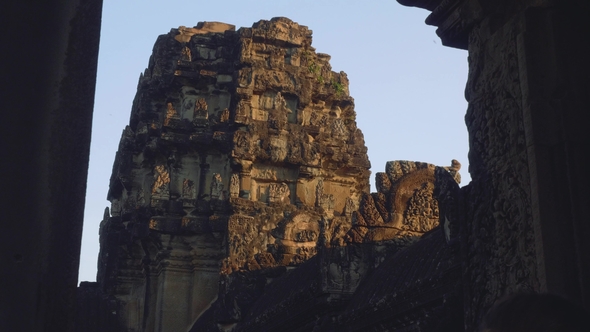 Monkey on Ruins of Angkor Wat Temple in Early Morning