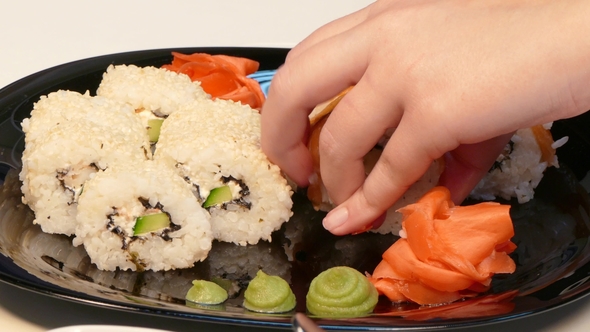 Carefully Lay Sushi Rolls on a Plate