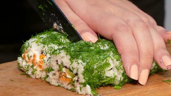 The Cook Cuts a Green Sushi Roll