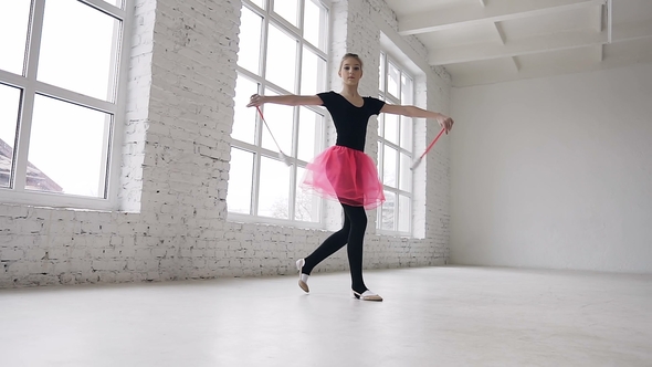 Cute Blonde Hair Girl Doing Exercive with Mace in the Hand in the Studio on White Background Near alt