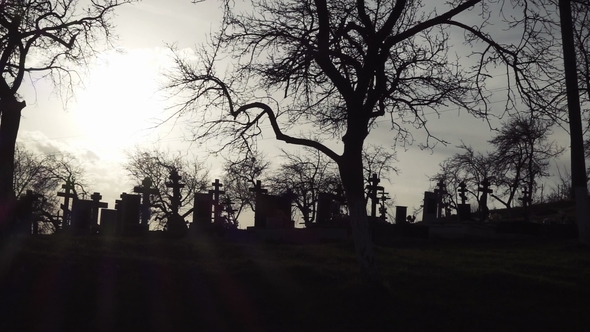 Old Graveyard with Ancient Crosses at Sunset