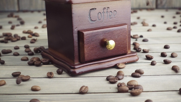 Pouring Coffee Beans Into Wooden Vintage Grinder,