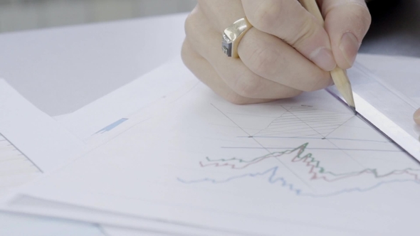 Hands of Young Male Financial Analytic, Who Is Researching Digital Currency Market Situation