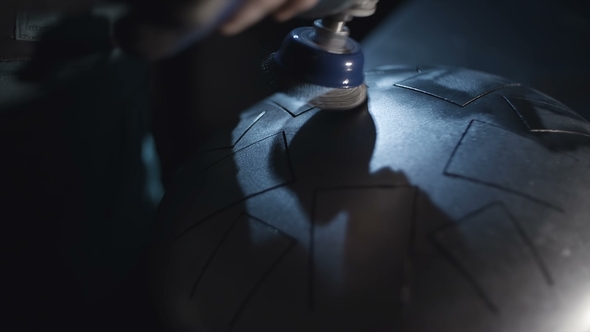 The Master Makes a Steel Tongue Drum. Men Polishing a Tank Drum alt