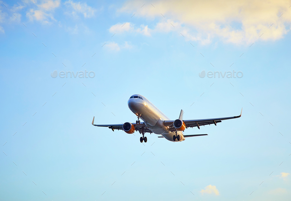 Flying airplain over blue sky - Stock Photo - Images