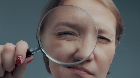 Portrait of Caucasian Wooman with Magnifier