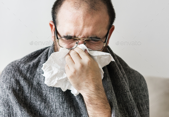 Man sneezing into tissue paper Stock Photo by Rawpixel | PhotoDune