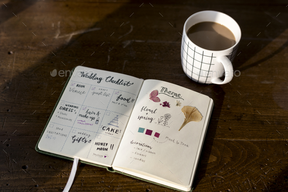 Closeup of wedding checklist notebook on wooden tabel - Stock Photo - Images