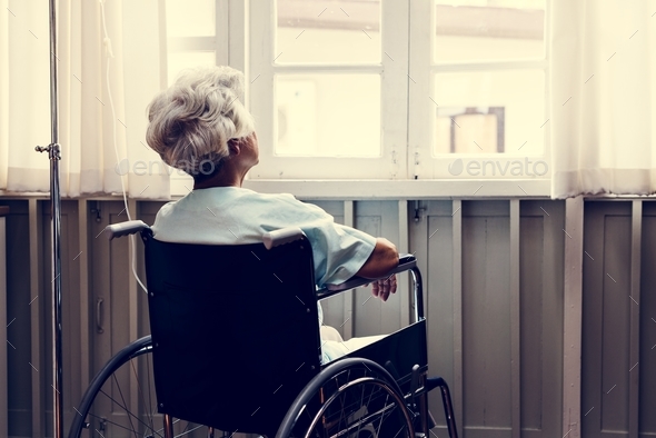 Old woman on a wheel chair - Stock Photo - Images