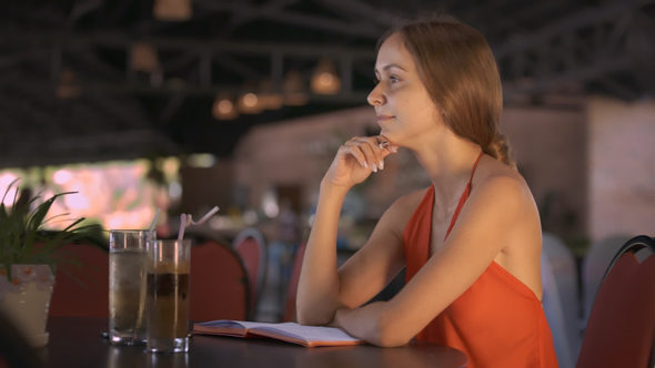 Girl Recalled Thought Writes down in Diary at Cafe alt