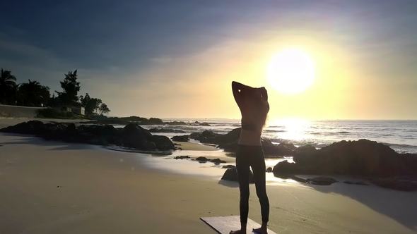 Slim Sports Girl Touches Hairs on Beach Aerial View alt