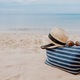 Summer Beach Bag on Sandy Beach Stock Image - Image of blue, flops: 17556481