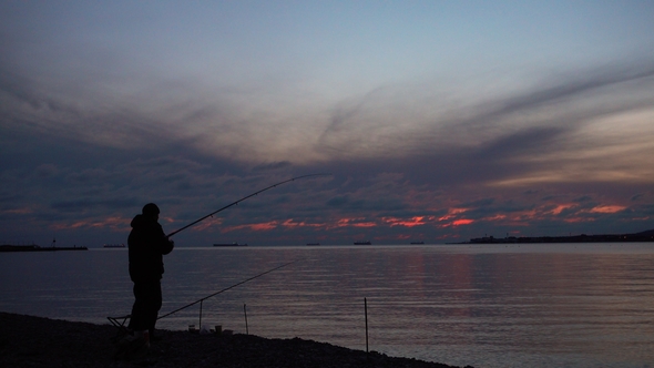 Fisherman Catch Fish at Beautiful Evening