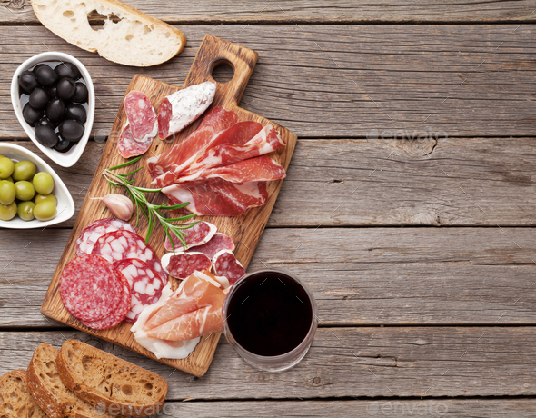 Salami, ham, sausage, prosciutto and wine - Stock Photo - Images