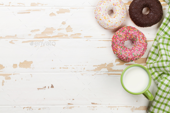 Milk and donuts on wooden table Stock Photo by karandaev | PhotoDune