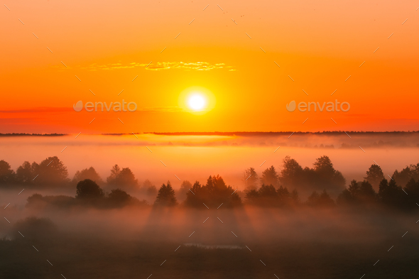 Amazing Sunrise Over Misty Landscape. Scenic View Of Foggy Morni Stock Photo by Grigory_bruev