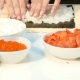 Chef Hands Kneading Rice on the Nori Sheet on the Kitchen Table - VideoHive Item for Sale