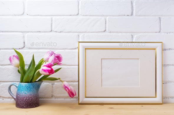 Gold decorated landscape frame mockup with magenta tulips - Stock Photo - Images