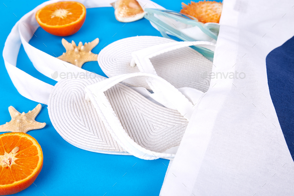 Summer beach bag with flip flops, - Stock Photo - Images