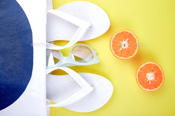 Summer beach bag with flip flops, - Stock Photo - Images