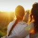 Mom and Daughter 11 Years Embrace, Look Together at a Beautiful Sunset. Good Relations in the Family - VideoHive Item for Sale