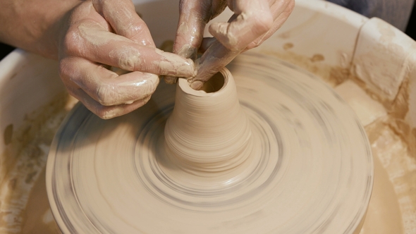 Man Works with a Potter's Wheel, Only Hands alt