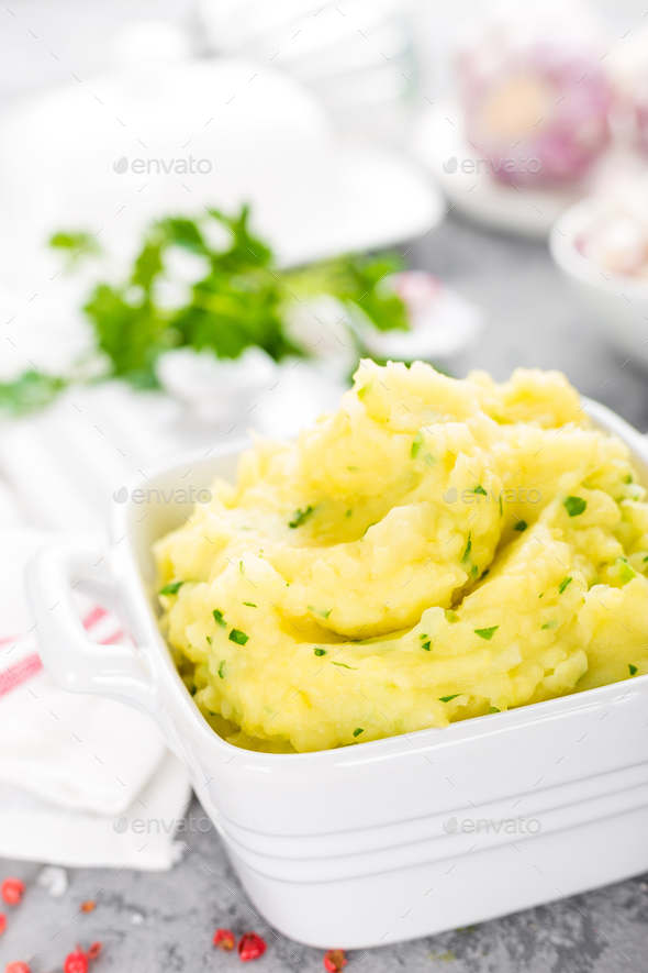 Mashed potato. Potato mash with garlic and parsley. Boiled potato. Potato puree Stock Photo by