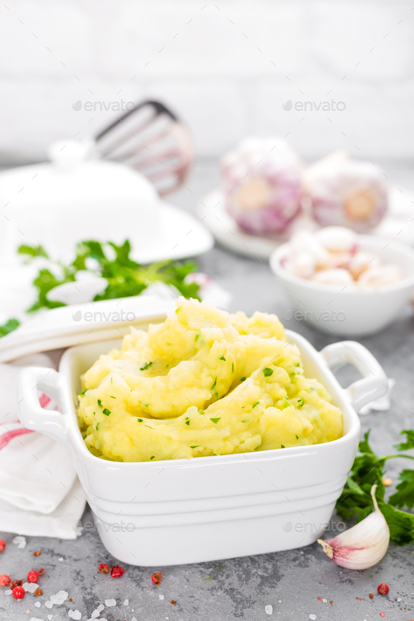 Mashed potato. Potato mash with garlic and parsley. Boiled potato. Potato puree Stock Photo by