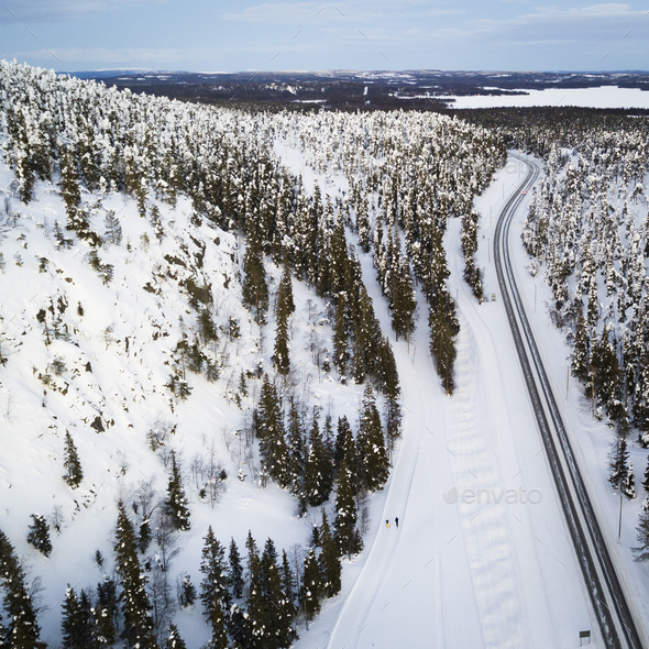 Aerial view of a winter road. Winter landscape countryside. Aerial photography of snow forest. - Stock Photo - Images