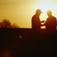 A Firm Handshake of Two Farmers on the Field. They Communicate, Use a Tablet. At Sunset - VideoHive Item for Sale
