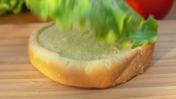 Chef Puts Lettuce Leaf on a Bun alt