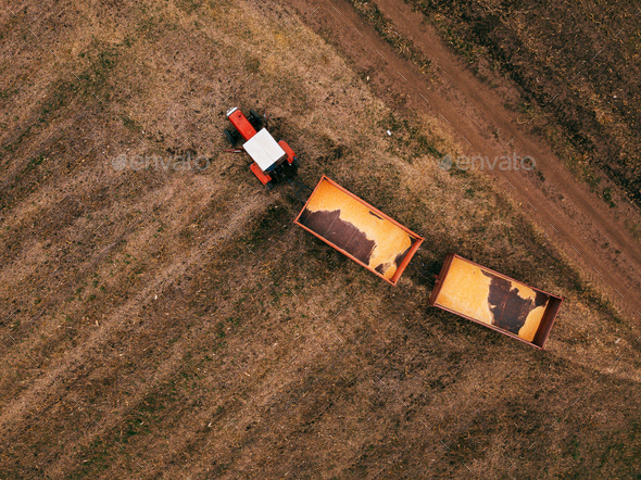 Aerial view of agricultural tractor in the field - Stock Photo - Images